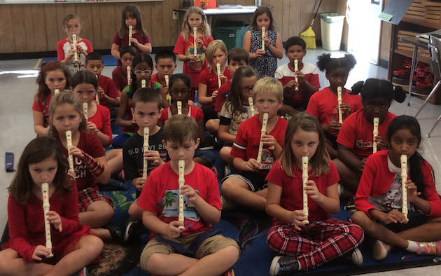 Students playing recorders